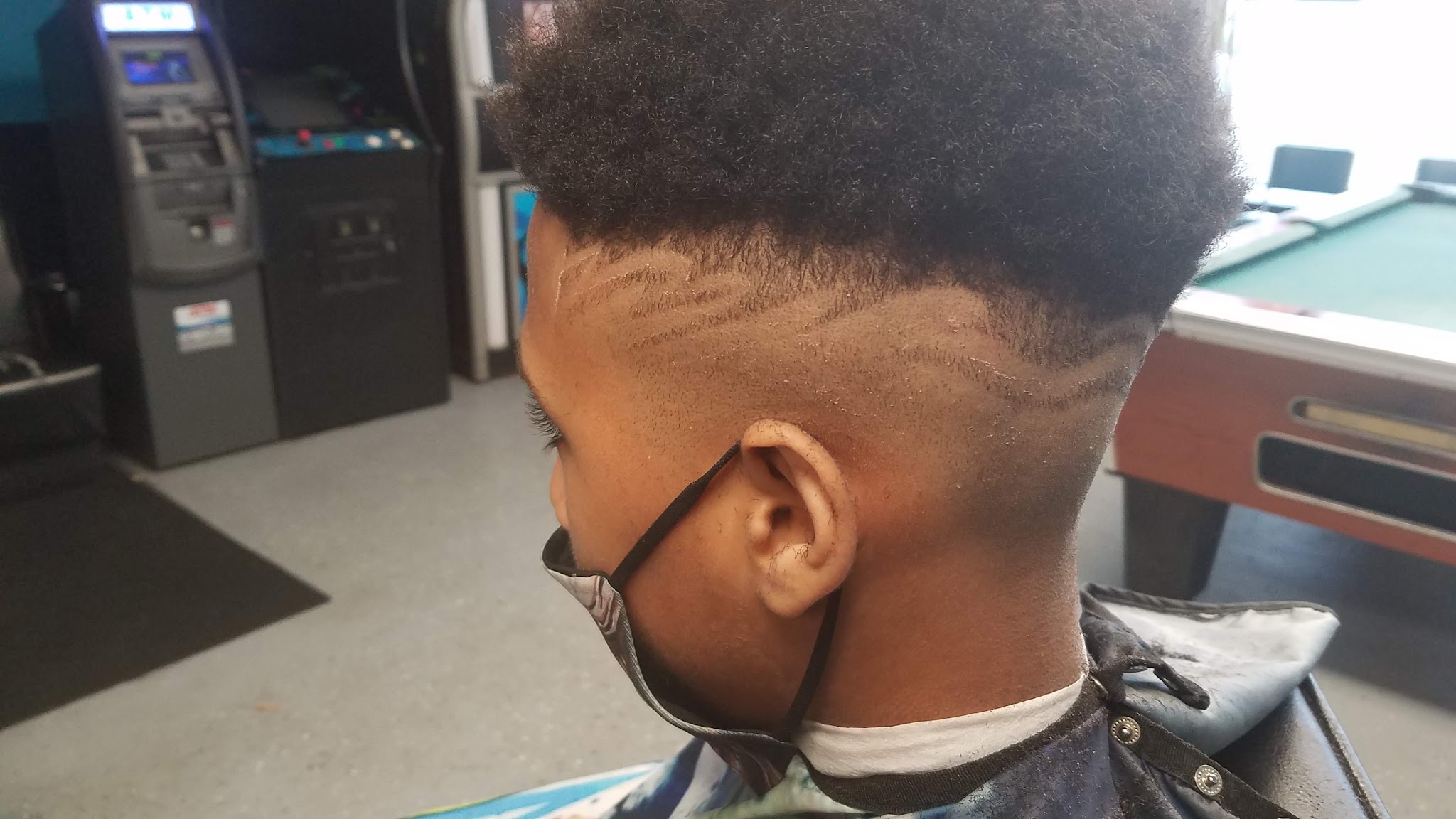 A taper with line work and a clean fade