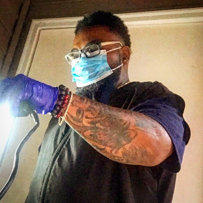Our barber at work with clippers
